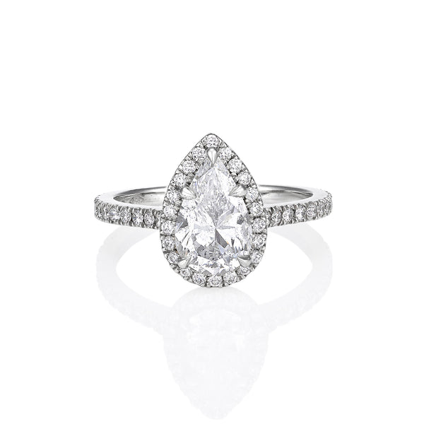 Pear shape diamond engagement ring with halo