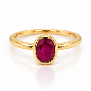 18ct yellow gold ring featuring a centre oval shape ruby