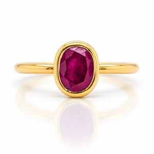 18ct yellow gold ring featuring a centre oval shape ruby