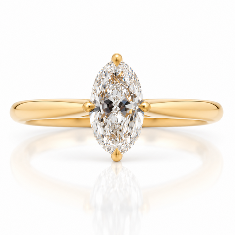 Oval diamond in a solitaire set with four claws