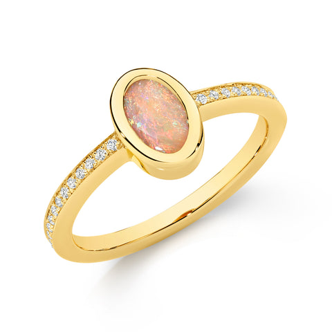 Gold ring with an opal stone and diamond accents on a white background