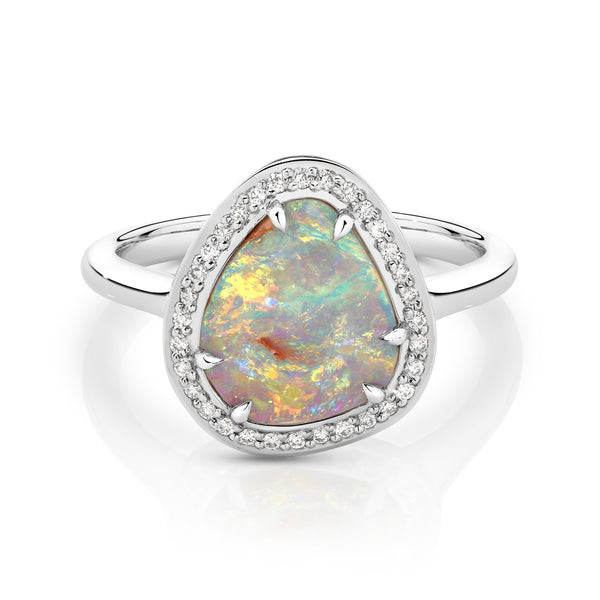 Platinum ring with a colorful opal stone on a white background