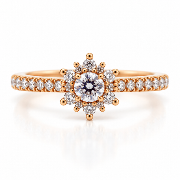 A rose gold engagement ring featuring a central round-cut diamond surrounded by a halo of smaller diamonds, with a pavé band, set against a clean white background with a soft reflection.