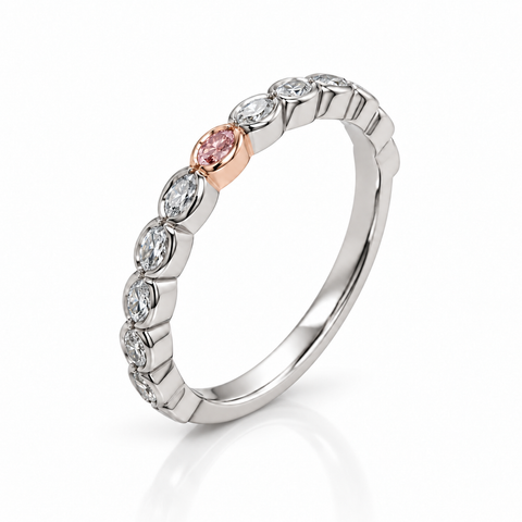 A silver-toned eternity ring featuring a row of clear oval diamond with a single rose gold oval center stone, shown on a white background with a soft reflection.