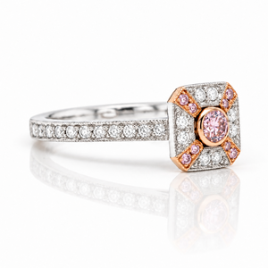 Platinum and 18ct rose gold ring with centre argyle pink diamond and halo of diamonds